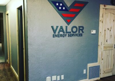 Picture of metal letters and logo for Valor Energy.